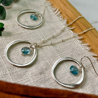 Sterling Silver Circle with Blue Topaz Drop Earrings