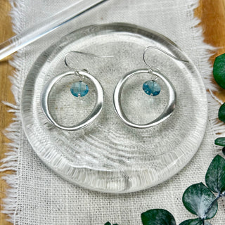 Sterling Silver Circle with Blue Topaz Drop Earrings