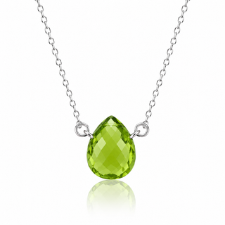 A silver chain necklace featuring a faceted, teardrop-shaped green gemstone pendant, displayed against a clean white background with a soft reflection below.
