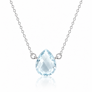 A silver chain necklace featuring a faceted light blue teardrop-shaped gemstone pendant, displayed on a clean white background with a soft reflection below.
