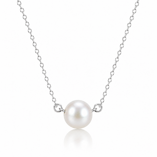 A delicate silver chain necklace featuring a single lustrous white pearl pendant in a polished silver bezel setting, displayed against a clean white background with a soft reflection below.