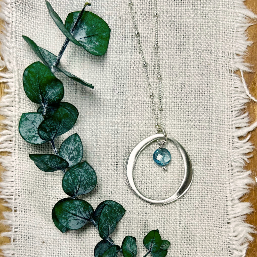 Sterling Silver Organic Circle Necklace with Blue Topaz Drop